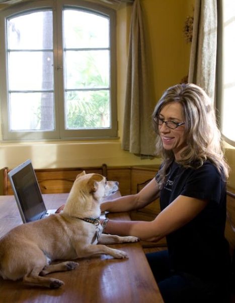 Joan and Poncho working at computer